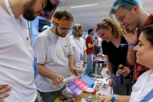 people talking at the stand